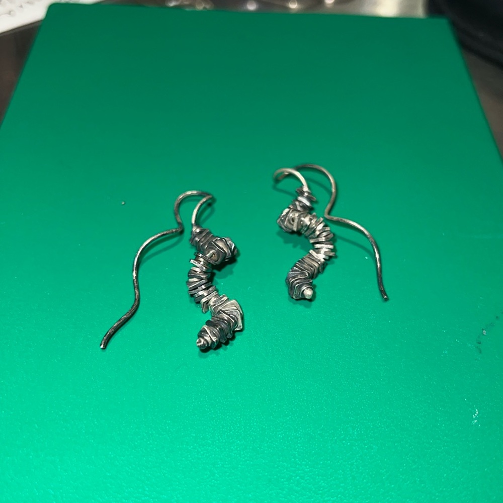 Silver spiral earrings. Handmade by artisan.